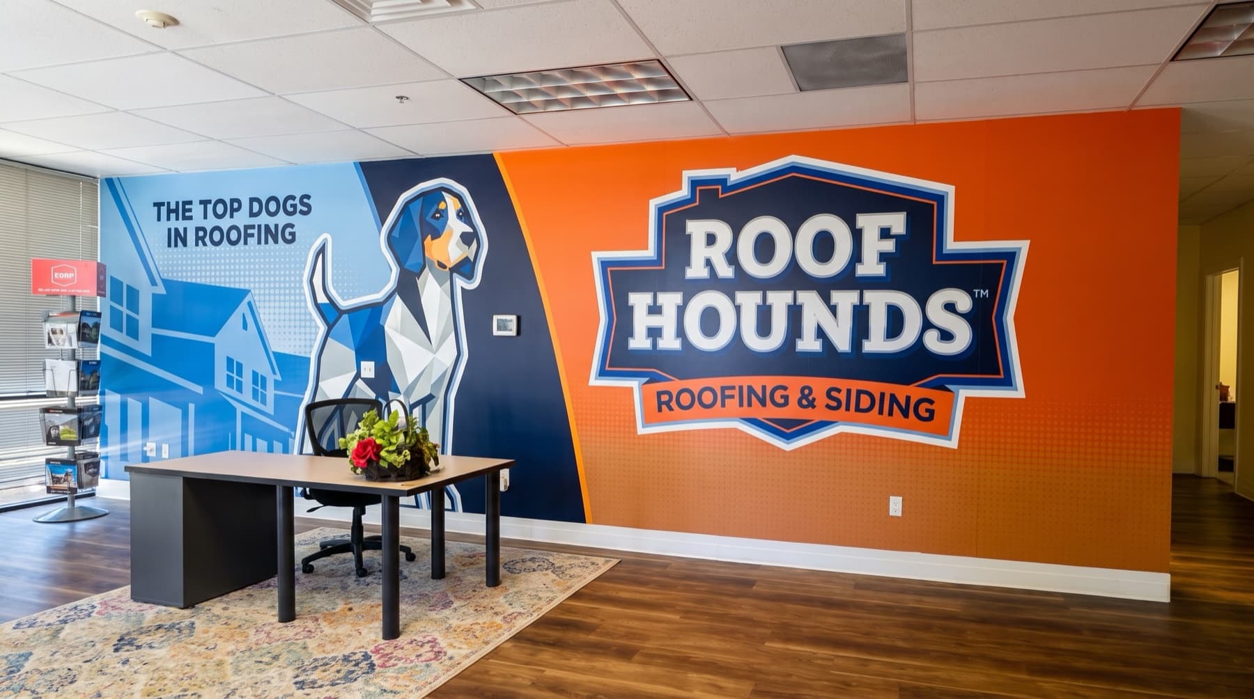 Roof Hounds branded feature wall in a Utah office