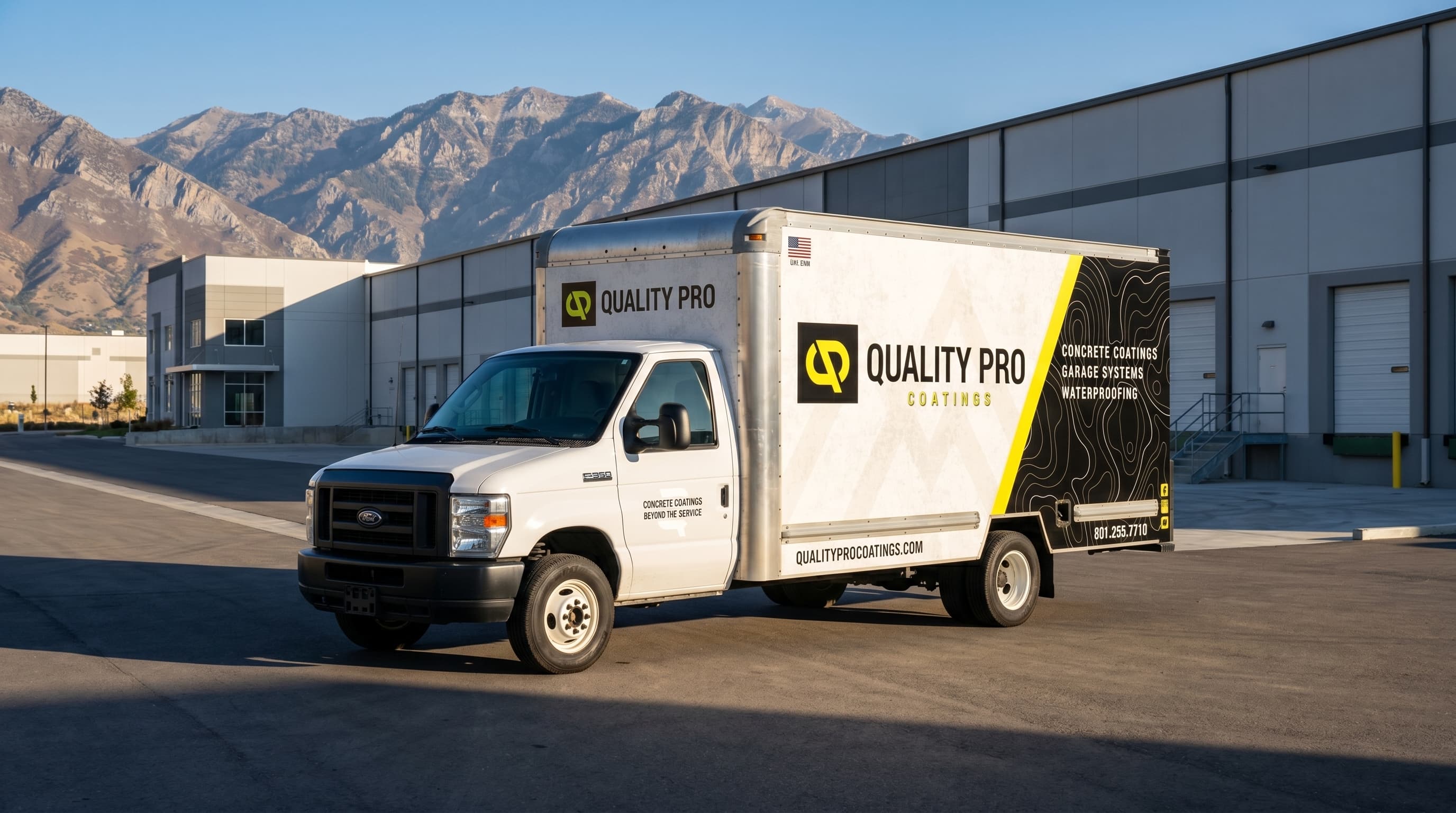 Quality Pro Coatings box truck at an industrial site